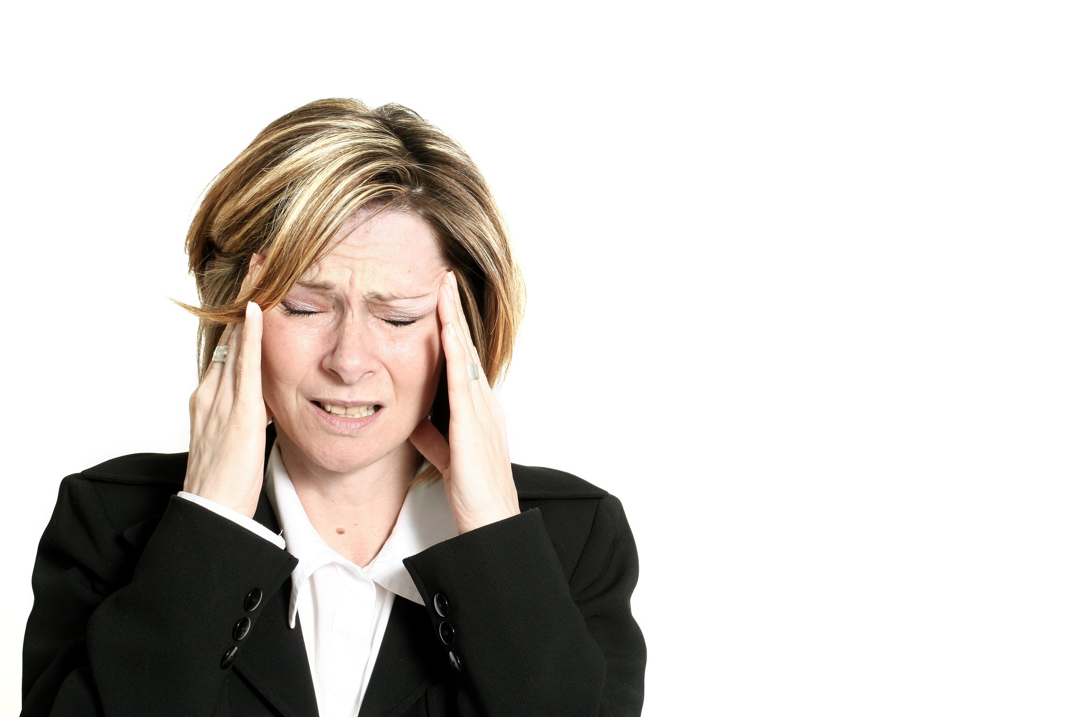Photo of a Business woman holding her head due to a headach